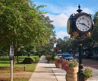 City of Winter Park - sidewalk, clock and trees